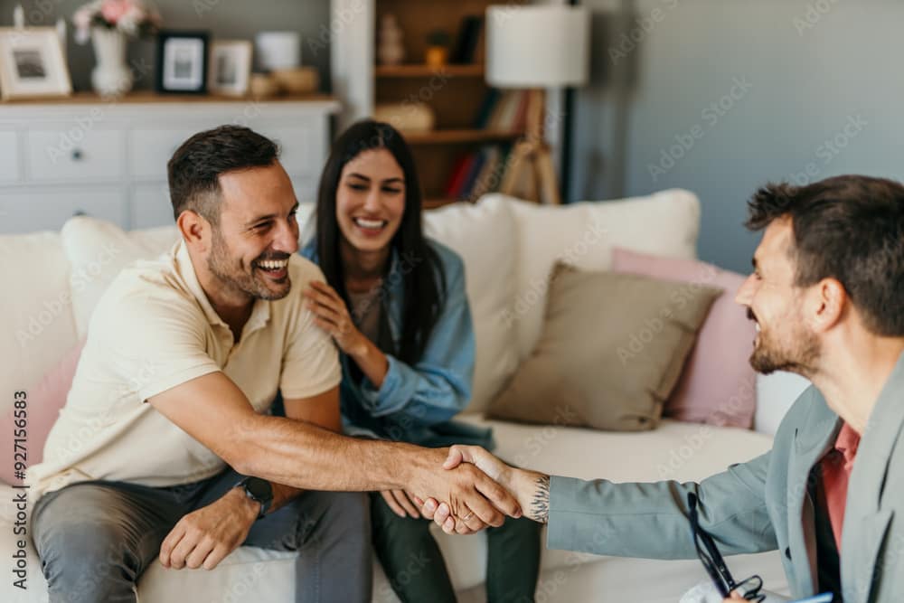 Happy man and woman clients handshake close deal or close the agreement with a real estate agent